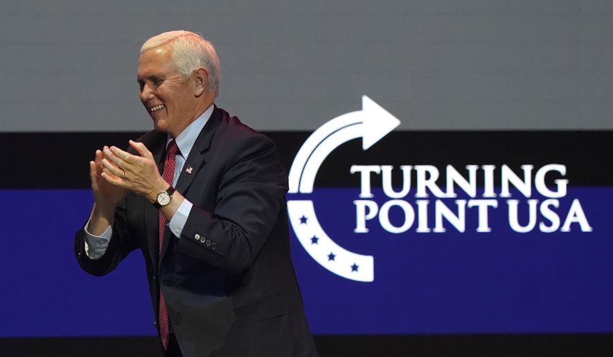 Vice President Mike Pence arrives on stage to speak during the Turning Point USA Student Action Summit, Tuesday, Dec. 22, 2020, in West Palm Beach, Fla. (AP Photo/Lynne Sladky)
