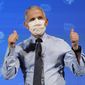 Dr. Anthony Fauci, director of the National Institute of Allergy and Infectious Diseases, gestures after receiving his first dose of the COVID-19 vaccine at the National Institutes of Health, Tuesday, Dec. 22, 2020, in Bethesda, Md. (AP Photo/Patrick Semansky, Pool)