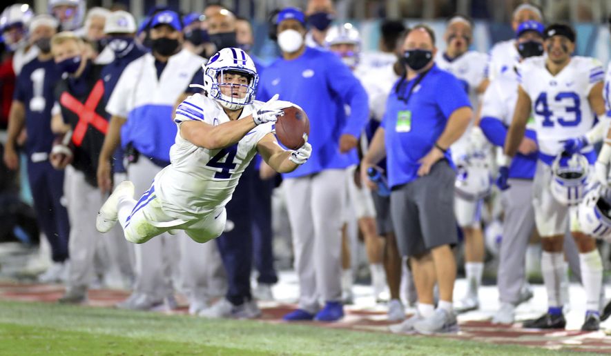 BYU's Troy Warner stretches out for a catch late in the second quarter against Central Florida in the Boca Raton Bowl NCAA college football game Tuesday, Dec. 22, 2020, in Boca Raton, Fla. (Mike Stocker/South Florida Sun-Sentinel via AP)