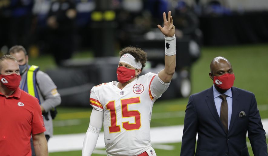 Kansas City Chiefs quarterback Patrick Mahomes (15) waves as he walks off the field after an NFL football game against the New Orleans Saints in New Orleans, Sunday, Dec. 20, 2020. The Chiefs won 32-29. (AP Photo/Brett Duke)