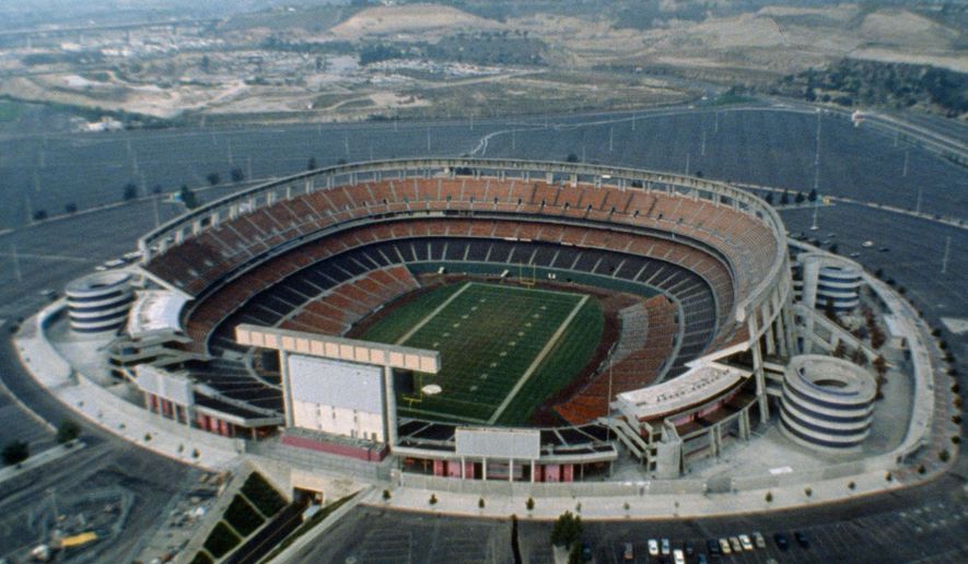 FILE - This 1987 file photo shows an aerial view of Jack Murphy Stadium in San Diego, Calif., site of Super Bowl XXII. Now the stadium is coming to an unceremonious end, leaving generations of fans feeling melancholy because, due to the coronavirus pandemic, they didn&#x27;t get to say a proper goodbye to the place where they tailgated with gusto in the massive parking lot before cheering on the Chargers, Padres and Aztecs, or watched myriad other events and concerts. (AP Photo/File)