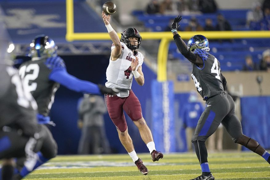 South Carolina quarterback Luke Doty (4) throws a pass during the second half of the team's NCAA college football game against Kentucky, Saturday, Dec. 5, 2020, in Lexington, Ky. (AP Photo/Bryan Woolston)