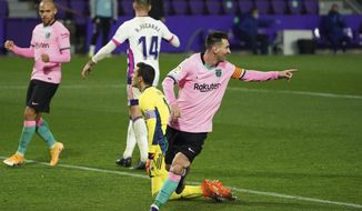 Barcelona&#39;s Lionel Messi celebrates after scoring his side&#39;s third goal during a Spanish La Liga soccer match between Valladolid and Barcelona at the Jose Zorrilla stadium in Valladolid, Spain,Tuesday Dec. 22, 2020. (Cesar Manso/Pool via AP)