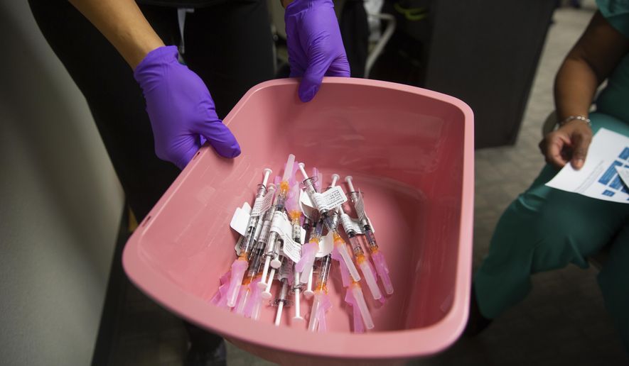 This Dec. 16, 2020 image provided by UNM Health shows a bin of COVID-19 vaccines for the first round of health care workers to be vaccinated at the University of New Mexico Health Sciences Center in Albuquerque, N.M. (UNM Health via AP)