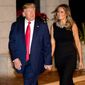 One year ago: President Trump and first lady Melania Trump arrive for Christmas Eve dinner at Mar-a-Lago in Palm Beach, Florida. (Associated Press)