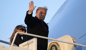 President Donald Trump waves as he boards Air Force One at Andrews Air Force Base, Md., Wednesday, Dec. 23, 2020. Trump is traveling to his Mar-a-Lago resort in Palm Beach, Fla. (AP Photo/Patrick Semansky)