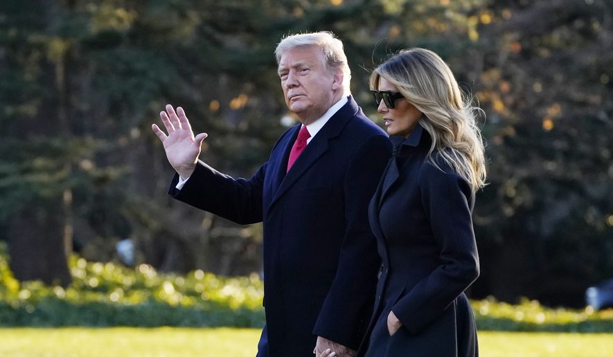 President Donald Trump and first lady Melania Trump walk to board Marine One on the South Lawn of the White House, Wednesday, Dec. 23, 2020, in Washington. (AP Photo/Evan Vucci) ** FILE **