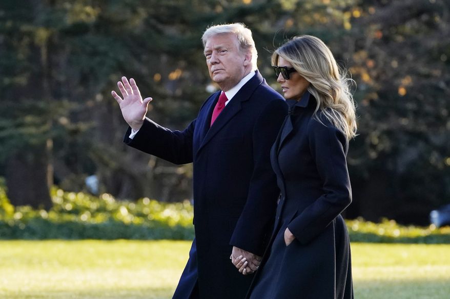 President Donald Trump and first lady Melania Trump walk to board Marine One on the South Lawn of the White House, Wednesday, Dec. 23, 2020, in Washington. (AP Photo/Evan Vucci) ** FILE **
