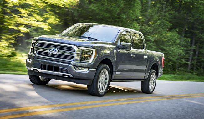 This photo provided by Ford Motor Co. shows the 2021 Ford F-150, a light-duty pickup truck with an upgraded interior, plus available hybrid and onboard generator options. (Ford Motor Co. via AP)