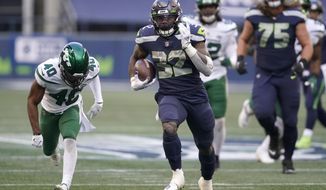 Seattle Seahawks running back Chris Carson carries against the New York Jets during the second half of an NFL football game, Sunday, Dec. 13, 2020, in Seattle. (AP Photo/Ted S. Warren)