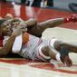 Rutgers forward Mamadou Doucoure, left, works for a loose ball against Ohio State forward E.J. Liddell during the first half of an NCAA college basketball game in Columbus, Ohio, Wednesday, Dec. 23, 2020. (AP Photo/Paul Vernon)