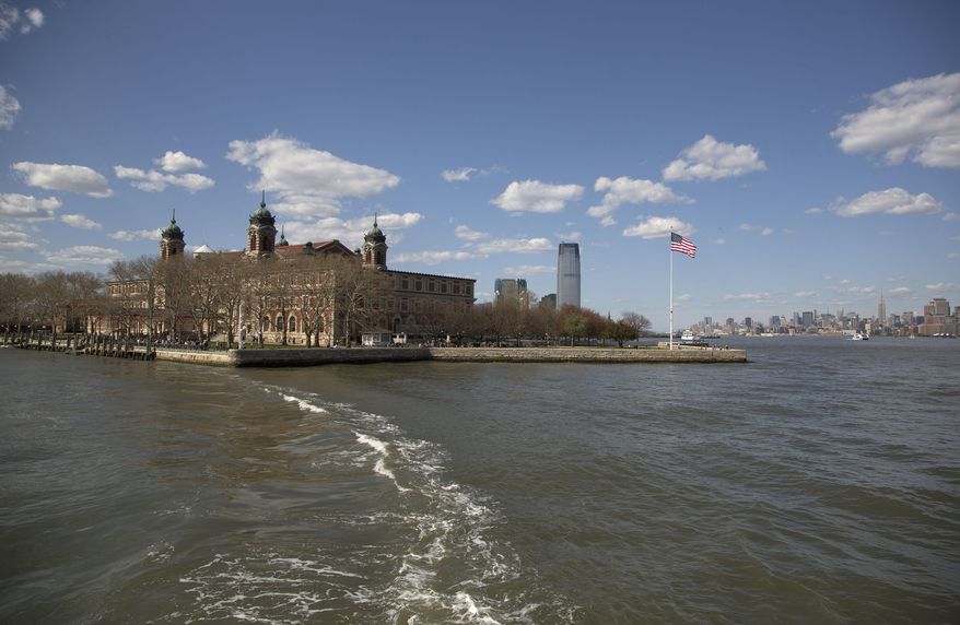 The wake from a ferry is seen trailing the boat as it leaves Ellis Island for Manhattan, on April 29, 2015, in New York. The location is featured in a collection of mini-essays by American writers published online by the Frommer's guidebook company about places they believe helped shape and define America. (AP Photo/Julie Jacobson) **FILE**
