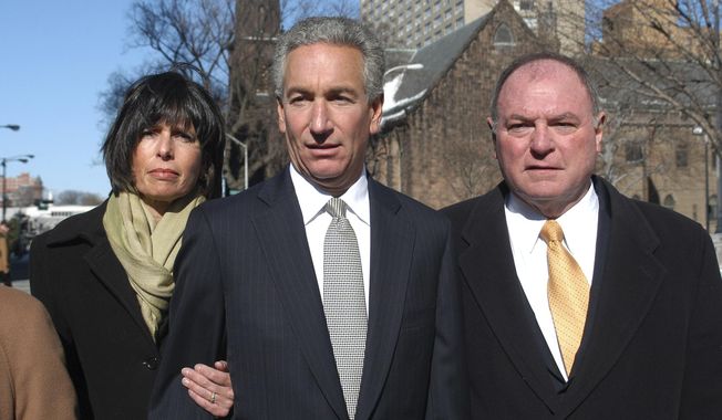 FILE - In this March 4, 2005 file photo, Charles B. Kushner, flanked by his wife, Seryl Beth, left, and his attorney Alfred DeCotiis arrives at the Newark Federal Court for sentencing in Newark, N.J. President Donald Trump on Wednesday, Dec. 23, 2020 issued pardons and sentence commutations for 29 people, including former campaign chairman Paul Manafort and Charles Kushner, the father of his son-in-law, in the latest burst of clemency in his final weeks at the White House. (AP Photo/Marko Georgiev, File)