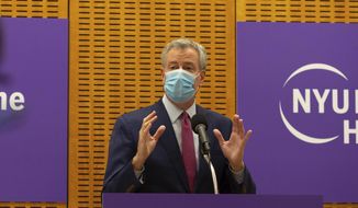 Mayor Bill de Blasio delivers remarks ahead of the first COVID-19 vaccinations at NYU-Langone Hospital on Monday, Dec. 14, 2020, in New York. Hundreds of thousands of health care workers across the country are expected to receive the vaccine this week. (AP Photo/Kevin Hagen).