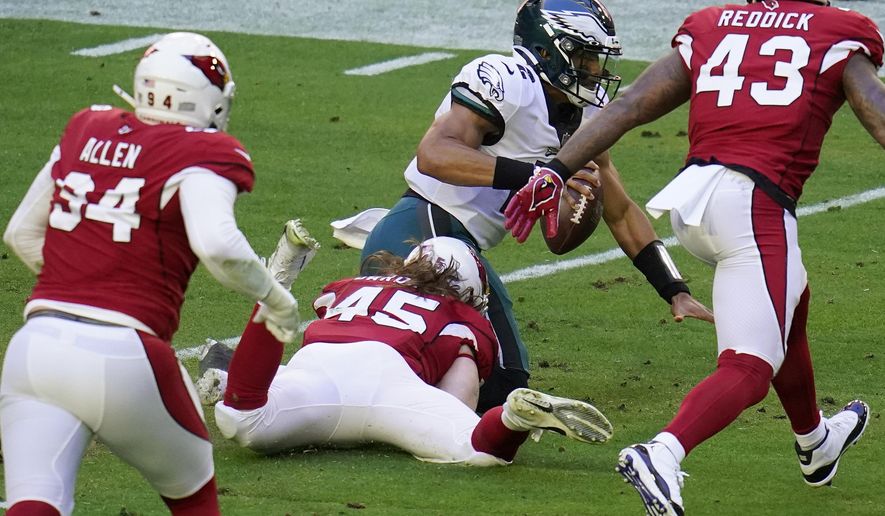 Arizona Cardinals linebacker Dennis Gardeck (45) sacks Philadelphia Eagles quarterback Jalen Hurts (2) during the first half of an NFL football game, Sunday, Dec. 20, 2020, in Glendale, Ariz. (AP Photo/Ross D. Franklin)