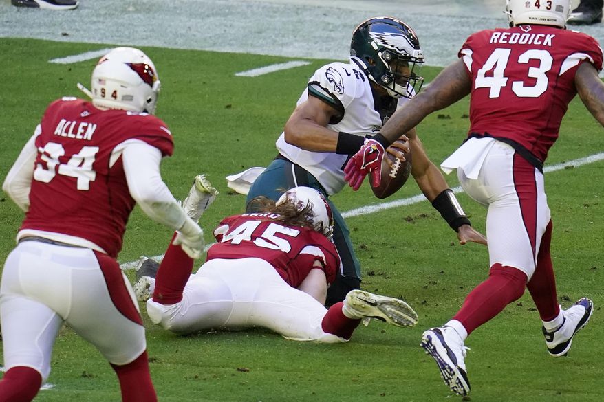 Arizona Cardinals linebacker Dennis Gardeck (45) sacks Philadelphia Eagles quarterback Jalen Hurts (2) during the first half of an NFL football game, Sunday, Dec. 20, 2020, in Glendale, Ariz. (AP Photo/Ross D. Franklin)