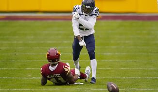 Seattle Seahawks free safety D.J. Reed (29) reacting after stopping Washington Football Team running back J.D. McKissic (41) from catching the ball during the first half of an NFL football game, Sunday, Dec. 20, 2020, in Landover, Md. (AP Photo/Andrew Harnik)
