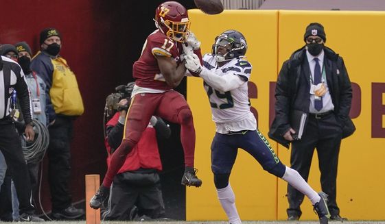 Seattle Seahawks free safety D.J. Reed (29) stops Washington Football Team wide receiver Terry McLaurin (17) from making a catch in the end zone during the second half of an NFL football game, Sunday, Dec. 20, 2020, in Landover, Md. (AP Photo/Andrew Harnik)
