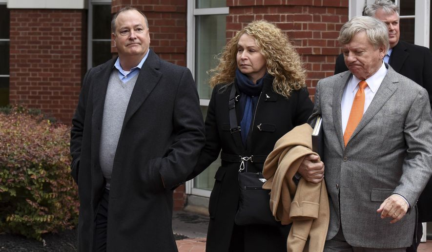 FILE - In this Feb. 9, 2016, file photo, former Pilot Flying J president Mark Hazelwood, left, leaves federal court after being arraigned in Knoxville, Tenn. A split U.S. 6th Circuit Court of Appeals panel in October tossed out convictions for Hazelwood and two of his former employees related to a rebate scheme to cheat trucking companies out of millions of dollars. The story was voted as the No. 10 news story in Tennessee in 2020. (Michael Patrick /Knoxville News Sentinel via AP, File)