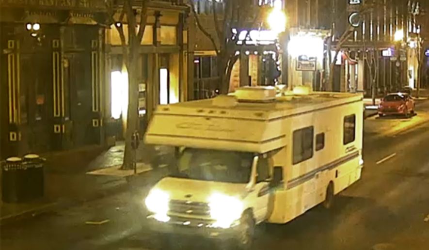This image taken from surveillance video provided by Metro Nashville PD shows a recreational vehicle that was involved in a blast on Friday, Dec. 25, 2020 in Nashville, Tenn.  An explosion shook the largely deserted streets early Christmas morning, shattering windows, damaging buildings and wounding some people. Police were responding to a report of shots fired when they encountered a recreational vehicle blaring a recording that said a bomb would detonate in 15 minutes, Metro Nashville Police Chief John Drake said. Police evacuated nearby buildings and called in the bomb squad.  (Metro Nashville PD via AP)