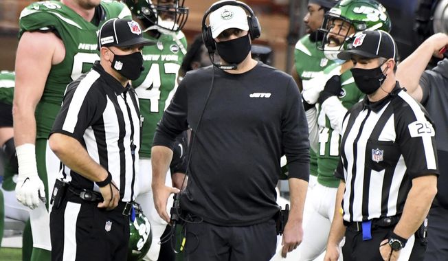 New York Jets head coach Adam Gase, center, looks on during a replay call in the second half of an NFL football game against the Los Angeles Rams in Inglewood, Calif., Sunday, Dec. 20, 2020. (Keith Birmingham/The Orange County Register via AP)