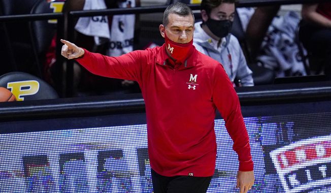 Maryland head coach Mark Turgeon directs his team during the first half of an NCAA college basketball game against Purdue in West Lafayette, Ind., Friday, Dec. 25, 2020. (AP Photo/Michael Conroy)