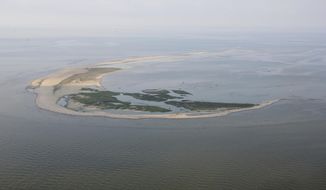 This photo, taken in July 2013 by Karen Westphal and provided by the U.S. Geological Survey, shows Breton Island, off Louisiana at the southern end of the 60-mile-long chain of barrier islands making up the nation’s second national wildlife refuge. Work has begun to more than double the area available for nesting seabirds on North Breton Island.  (Karen Westphal/U.S. Geological Survey via AP)