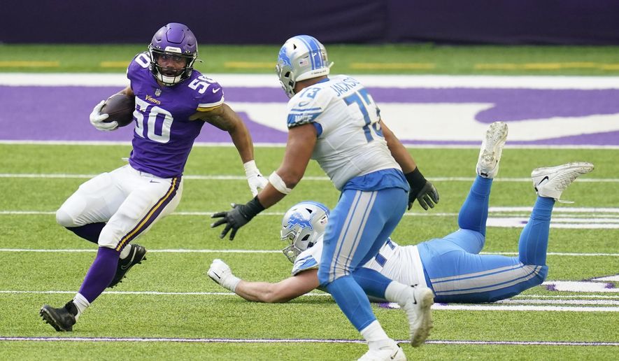Minnesota Vikings linebacker Eric Wilson (50) runs from Detroit Lions' Frank Ragnow and Jonah Jackson (73) after intercepting a pass during the second half of an NFL football game, Sunday, Nov. 8, 2020, in Minneapolis. (AP Photo/Jim Mone)