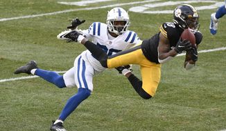 Pittsburgh Steelers wide receiver Diontae Johnson (18) makes a catch past Indianapolis Colts cornerback Rock Ya-Sin (26) for a touchdown during the second half of an NFL football game, Sunday, Dec. 27, 2020, in Pittsburgh. (AP Photo/Don Wright)