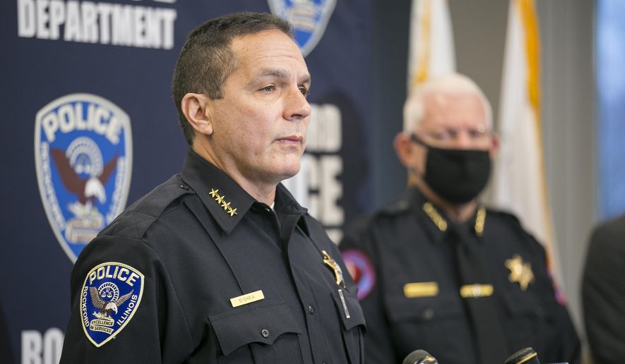 Rockford Police Chief Dan O&#39;Shea identifies the suspected shooter in a triple homicide the night before as Duke Webb, of Florida, during a news conference at Rockford Police Department District 3 on Sunday, Dec. 27, 2020, in Rockford, Ill. Webb allegedly opened fire inside Rockford bowling alley Don Carter Lanes on Saturday, killing three people and wounding three others. (Scott P. Yates/Rockford Register Star via AP)