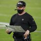 Las Vegas Raiders head coach Jon Gruden stands on the sidelines during the second half of an NFL football game against the Miami Dolphins, Saturday, Dec. 26, 2020, in Las Vegas. (AP Photo/Steve Marcus)