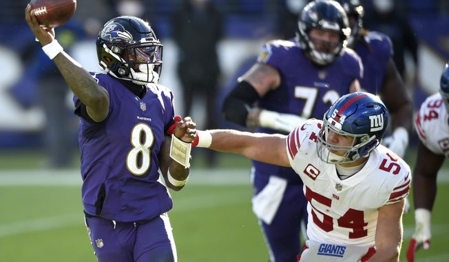 Baltimore Ravens quarterback Lamar Jackson (8) looks to throw a pass as New York Giants inside linebacker Blake Martinez (54) applies pressure during the first half of an NFL football game, Sunday, Dec. 27, 2020, in Baltimore. (AP Photo/Gail Burton)