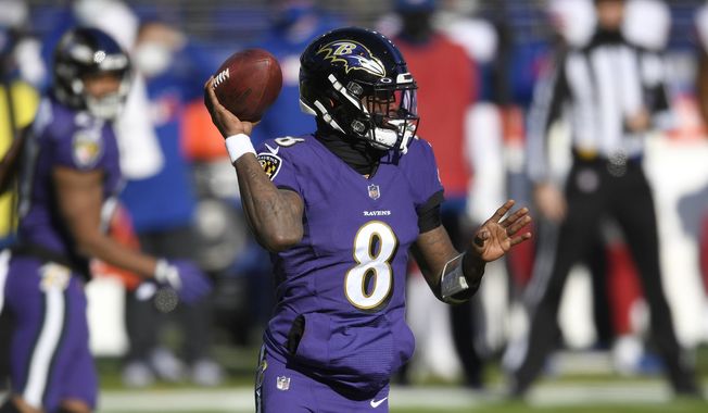Baltimore Ravens quarterback Lamar Jackson looks to throw a pass against the New York Giants during the first half of an NFL football game, Sunday, Dec. 27, 2020, in Baltimore. (AP Photo/Nick Wass)