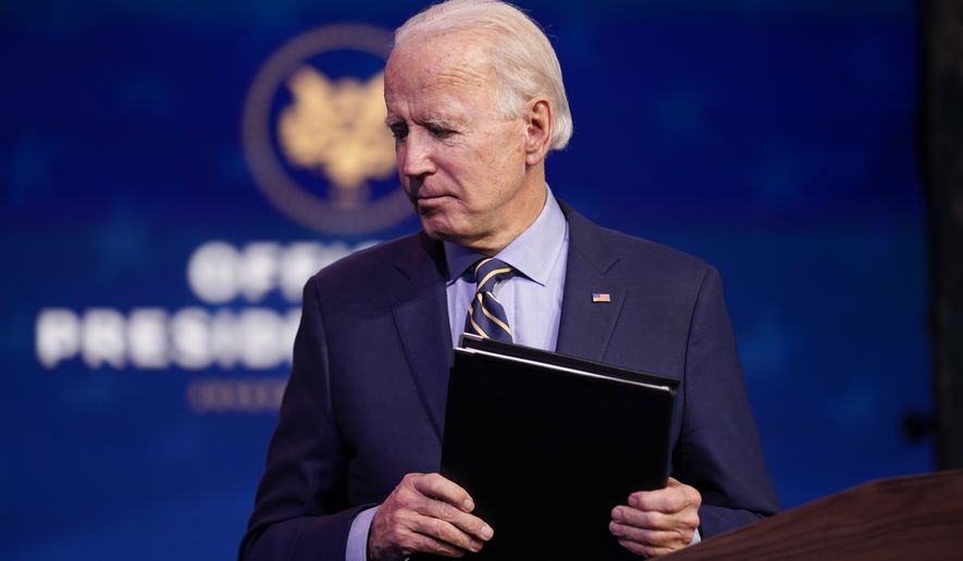 President-elect Joe Biden leaves after speaking at The Queen theater, Monday, Dec. 28, 2020, in Wilmington, Del. (AP Photo/Andrew Harnik) **FILE**