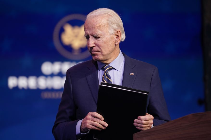 President-elect Joe Biden leaves after speaking at The Queen theater, Monday, Dec. 28, 2020, in Wilmington, Del. (AP Photo/Andrew Harnik) **FILE**