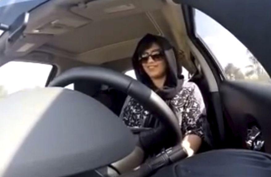 FILE - In this Nov. 30, 2014 image made from video released by Loujain al-Hathloul, al-Hathloul drives towards the United Arab Emirates - Saudi Arabia border before her arrest on Dec. 1 in Saudi Arabia. Al-Hathloul, one of Saudi Arabias most prominent womens rights activists, who pushed for the right to drive, was sentenced on Monday, Dec. 28, 2020, to nearly six years in prison under a vague and broadly-worded law aimed at combating terrorism, according to state-linked media. Her case and imprisonment for the past two and a half years have drawn criticism from rights groups, members of the U.S. Congress and European Union lawmakers. (Loujain al-Hathloul via AP, File)