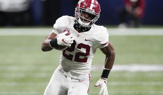 Alabama running back Najee Harris (22) runs against Florida during the second half of the Southeastern Conference championship NCAA college football game, Saturday, Dec. 19, 2020, in Atlanta. Harris has been selected to The Associated Press All-America first-team offense, Monday, Dec. 28, 2020. (AP Photo/John Bazemore)