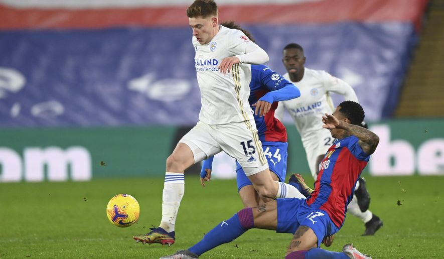 Leicester&#x27;s Harvey Barnes, left, and Crystal Palace&#x27;s Nathaniel Clyne challenge for the ball during the English Premier League soccer match between Crystal Palace and Leicester City at Selhurst Park stadium in London, Monday, Dec., 28, 2020. (Facundo Arrizabalaga/Pool via AP)