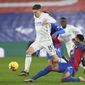 Leicester&#x27;s Harvey Barnes, left, and Crystal Palace&#x27;s Nathaniel Clyne challenge for the ball during the English Premier League soccer match between Crystal Palace and Leicester City at Selhurst Park stadium in London, Monday, Dec., 28, 2020. (Facundo Arrizabalaga/Pool via AP)