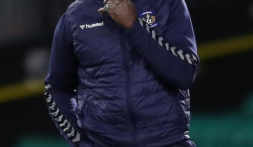 FILE - Dec. 13, 2020 file photo of Kilmarnock soccer manager Alex Dyer. The Kilmarnock soccer team in Scotland’s top league says its manager has been the target of a racially abusive letter. Kilmarnock says it “utterly condemns” the letter containing abuse directed at Alex Dyer who became the league’s only Black manager when he was appointed this summer. (Jane Barlow/PA via AP)