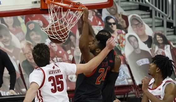 Maryland&#39;s Donta Scott dunks during the second half of an NCAA college basketball game against Wisconsin Monday, Dec. 28, 2020, in Madison, Wis. (AP Photo/Morry Gash)