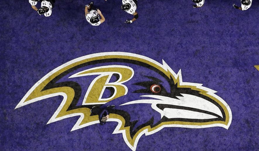 The Baltimore Ravens walk past the team logo in the end zone during warmups for the NFL Super Bowl XLVII football game against the San Francisco 49ers in New Orleans, in this Sunday, Feb. 3, 2013, file photo. The Baltimore Ravens were fined $250,000 by the NFL for violating COVID-19 protocols, a person with direct knowledge of the punishment told The Associated Press on Monday, Dec. 28, 2020. (AP Photo/David J. Phillip, File) **FILE**