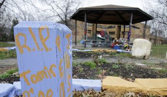 &quot;R.I.P. Tamir Rice&quot; is written on a wooden post near a makeshift memorial at the gazebo where the boy was fatally shot, outside the Cudell Recreation Center in Cleveland. (AP Photo/Tony Dejak, File)