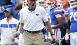 FILE - In this Oct. 3, 2020, file photo, Florida head coach Dan Mullen yells to a referee about a call during an NCAA college football game against South Carolina in Gainesville, Fla. Oklahoma and Florida will play in the Cotton Bowl on Wednesday, Dec. 30 in Arlington, Texas. (Brad McClenny/The Gainesville Sun via AP, File)