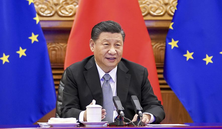 In this photo released by Xinhua News Agency, Chinese President Xi Jinping speaks during a video conference with European leaders from Beijing on Wednesday, Dec. 30, 2020. European Union top officials and Chinese President Xi Jinping have concluded a long-awaited business investment deal with the potential to annoy the new American administration. (Li Xueren/Xinhua via AP)