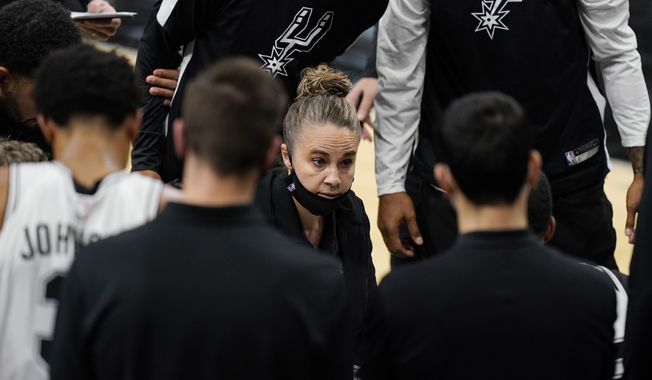 San Antonio Spurs assistant coach Becky Hammon calls a play during a timeout in the second half of an NBA basketball game against the Los Angeles Lakers in San Antonio, Wednesday, Dec. 30, 2020. (AP Photo/Eric Gay)