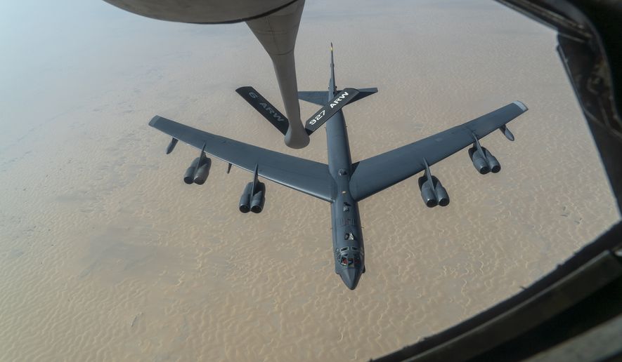 A U.S. Air Force B-52H Stratofortress from Minot Air Force Base, N.D., is refueled by a KC-135 Stratotanker in the U.S. Central Command area of responsibility Wednesday, Dec. 30, 2020. The United States flew strategic bombers over the Persian Gulf on Wednesday for the second time this month, a show of force meant to deter Iran from attacking American or allied targets in the Middle East. (Senior Airman Roslyn Ward/U.S. Air Force via AP)
