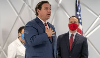Florida Governor Ron DeSantis speaks during a press conference in the King&#39;s Point clubhouse in Delray Beach, Fla., on Wednesday, Dec. 30, 2020. (Greg Lovett /The Palm Beach Post via AP)