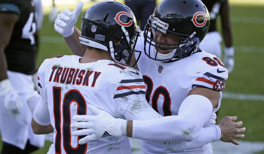 Chicago Bears quarterback Mitchell Trubisky (10) celebrates his touchdown run against the Jacksonville Jaguars with teammate tight end Jimmy Graham during the second half of an NFL football game, Sunday, Dec. 27, 2020, in Jacksonville, Fla. (AP Photo/Stephen B. Morton)