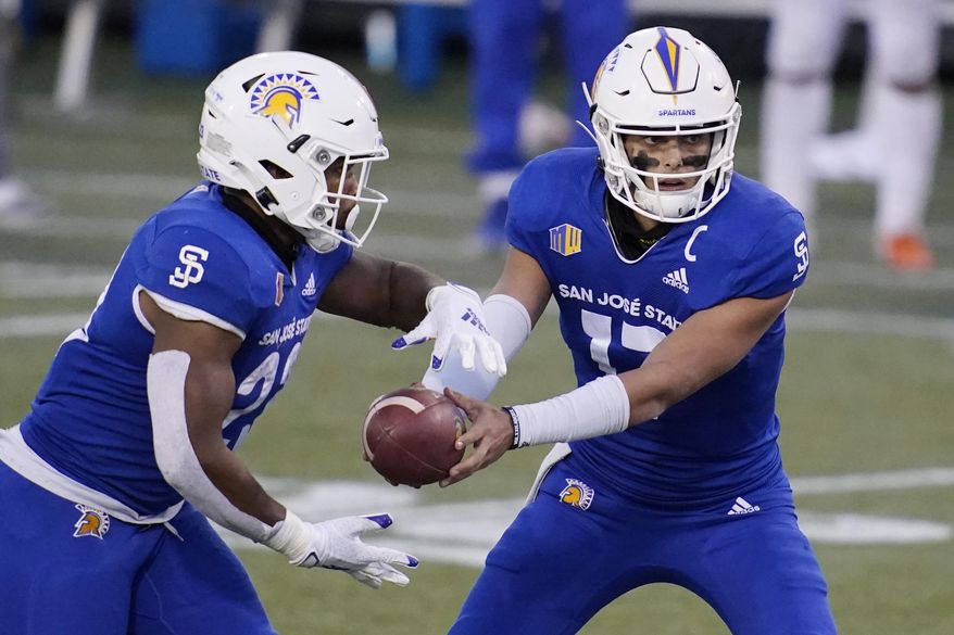 San Jose State quarterback Nick Starkel (17) hands off to running back Tyler Nevens (23) during the second half of an NCAA college football game against Boise State for the Mountain West championship, Saturday, Dec. 19, 2020, in Las Vegas. (AP Photo/John Locher)